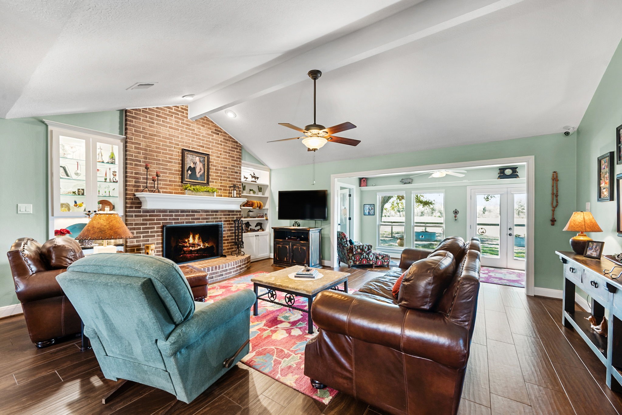 26253 Sharp Road Katy, TX 77493 - Photo 5 of 25 The formal living room offers an open setting for gatherings, with vaulted ceilings and beautiful flooring that adds to the room’s comfortable feel.