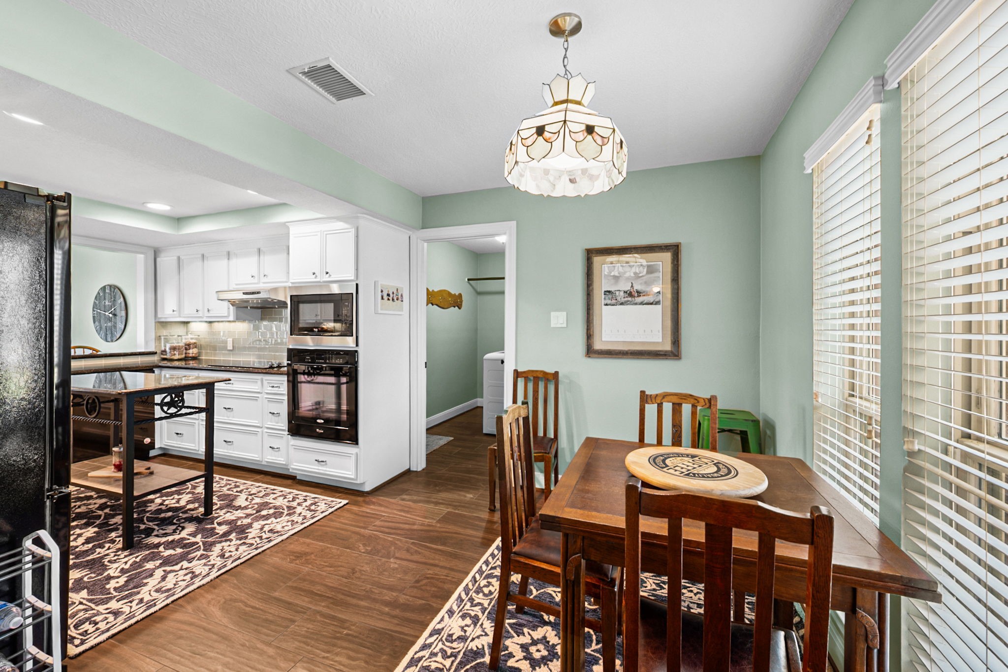 26253 Sharp Road Katy, TX 77493 - Photo 8 of 25 Imagine starting your day in this comfortable breakfast nook, where the chandelier brightens the space off of the kitchen.