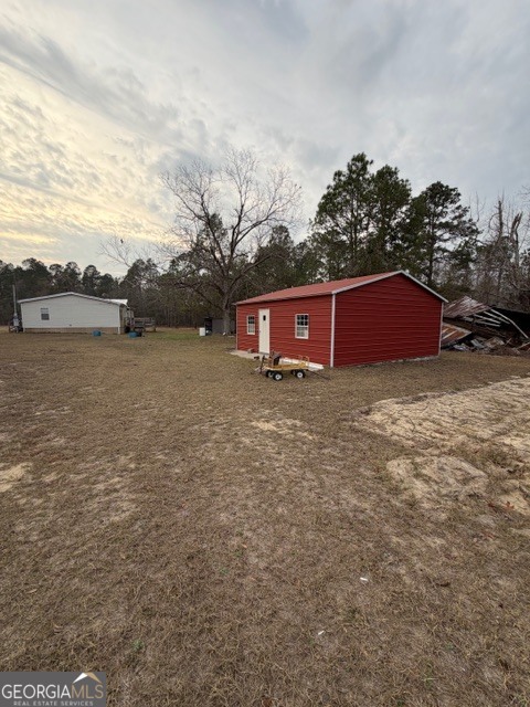 163 Dellwood Road Swainsboro, GA 30401 - Photo 22 of 23 a view of a houses with a yard