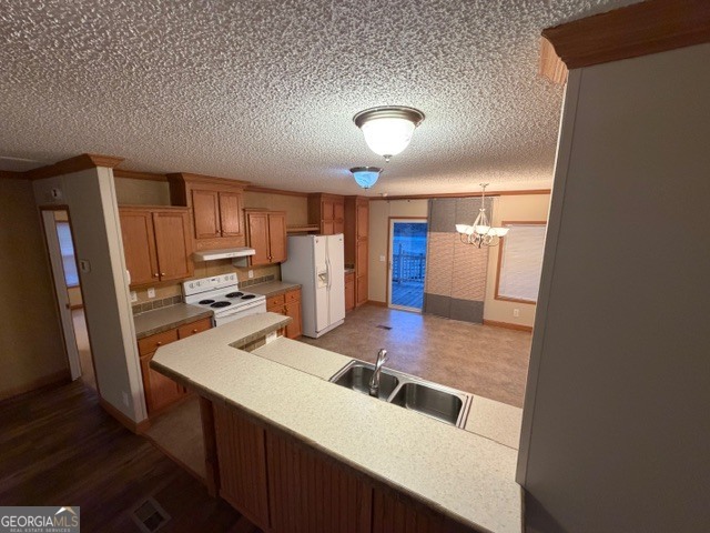 163 Dellwood Road Swainsboro, GA 30401 - Photo 8 of 23 a kitchen with refrigerator and sink