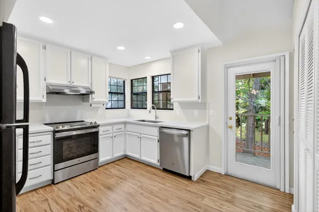 a kitchen with a sink and a window