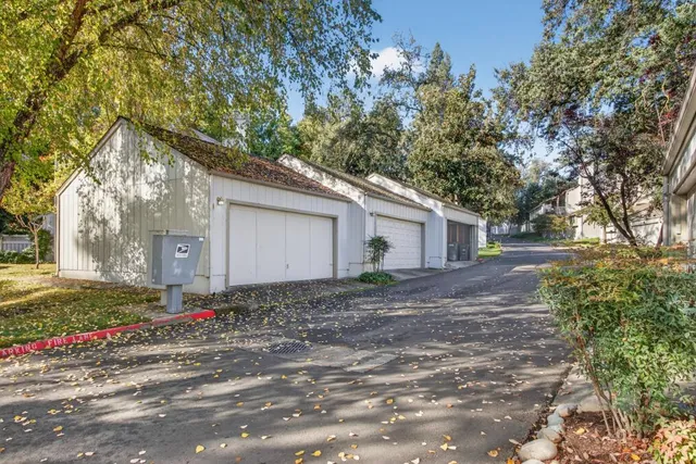 a view of a backyard with swimming pool