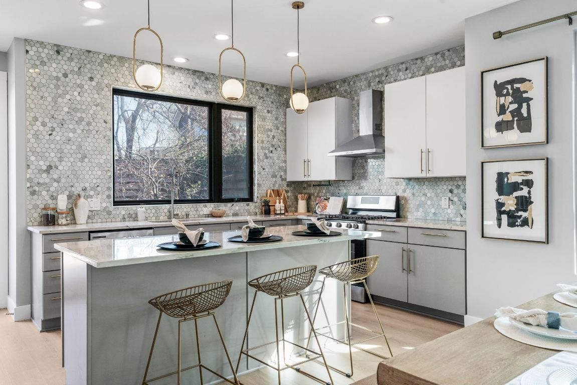 3612 Thompson Street, Unit 1 Austin, TX 78702 - Photo 15 of 40 Textured tile, modern hardware, and clean lines deliver a kitchen that feels custom and current.