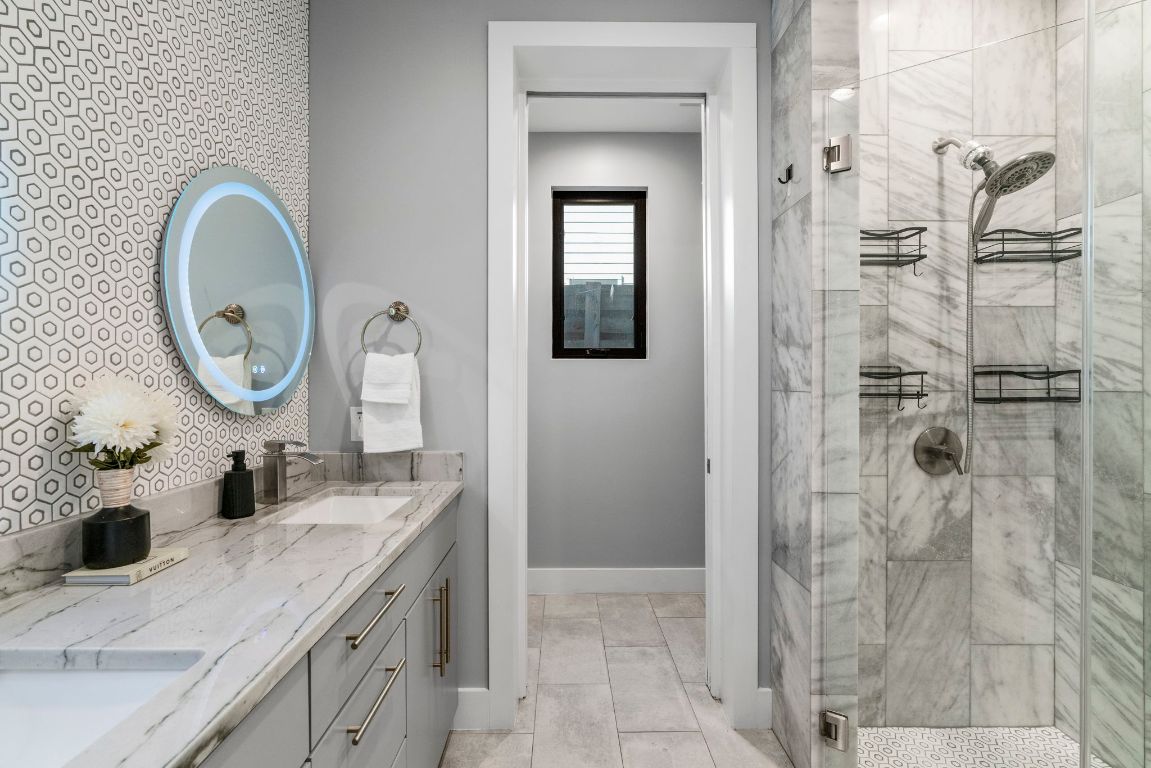 3612 Thompson Street, Unit 1 Austin, TX 78702 - Photo 20 of 40 Spa-inspired finishes and a walk-in shower bring a boutique-hotel feel to the everyday routine.