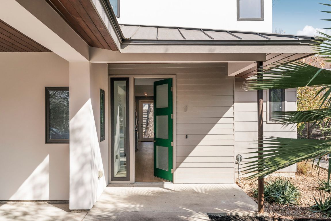 3612 Thompson Street, Unit 1 Austin, TX 78702 - Photo 3 of 40 Modern lines, a metal roof, and bold black-framed windows create serious curb appeal from the moment you arrive.