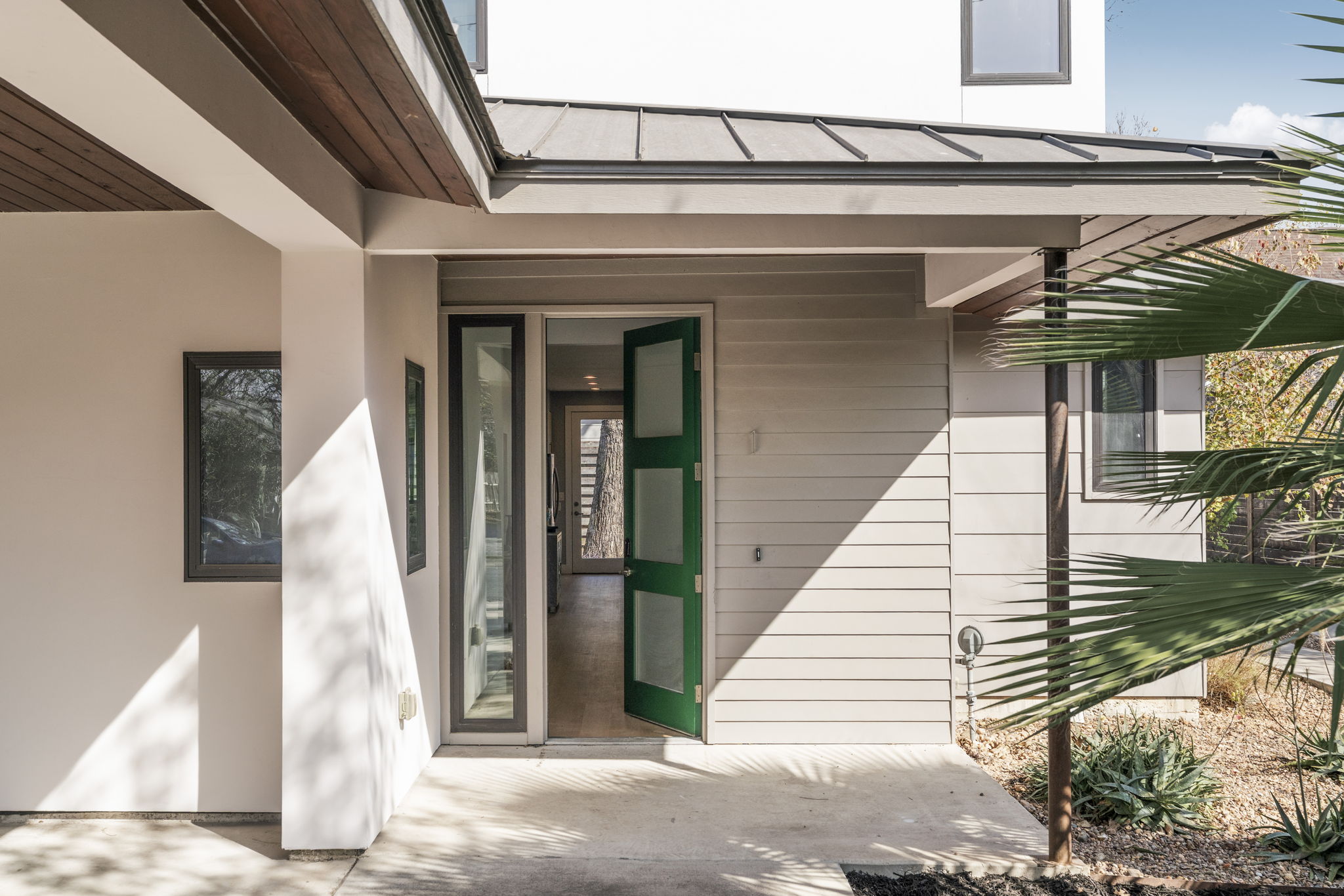 3612 Thompson Street, Unit 1 Austin, TX 78702 - Photo 3 of 40 Modern lines, a metal roof, and bold black-framed windows create serious curb appeal from the moment you arrive.