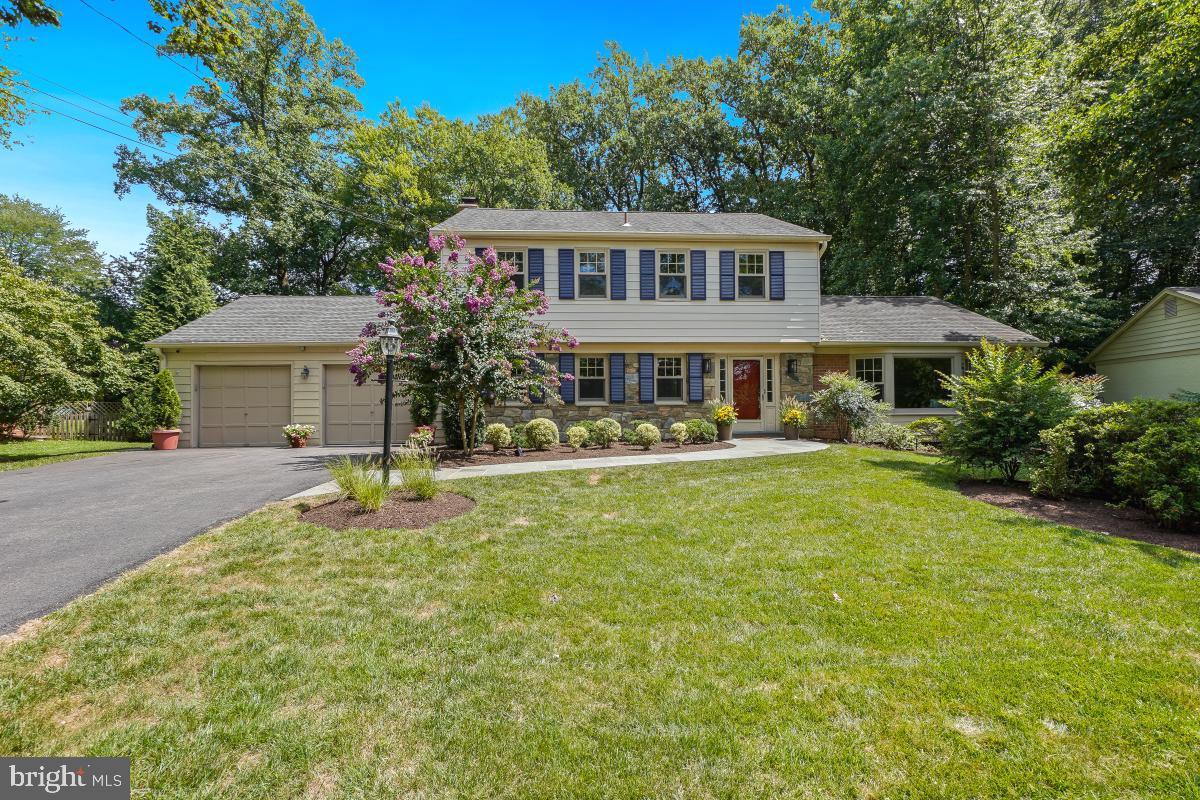 a front view of a house with a yard table and chairs