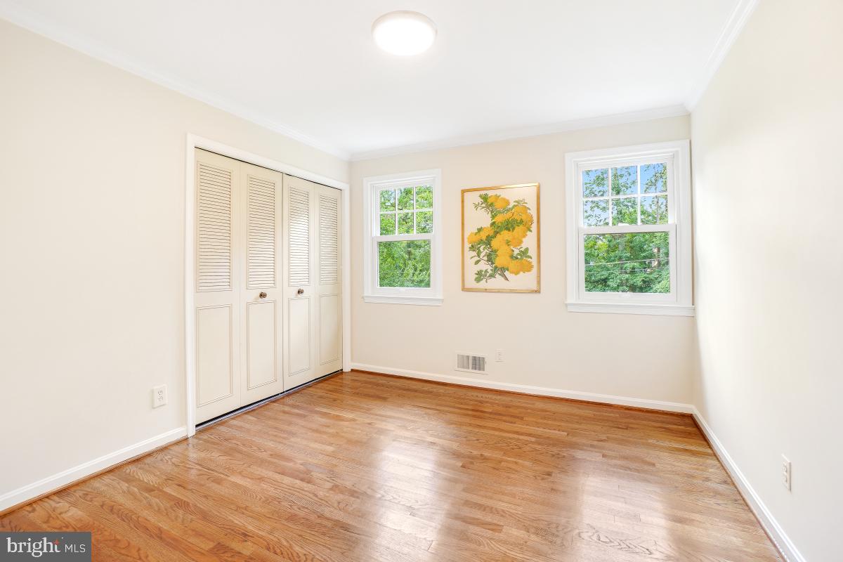 11321 Marcliff Road North Bethesda, MD 20852 - Photo 20 of 48 an empty room with wooden floor and windows