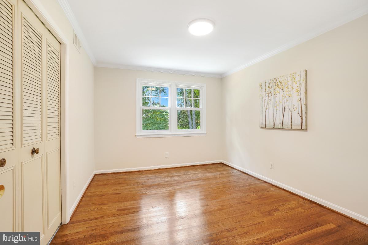 11321 Marcliff Road North Bethesda, MD 20852 - Photo 22 of 48 an empty room with wooden floor and windows