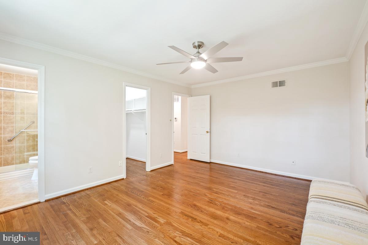 11321 Marcliff Road North Bethesda, MD 20852 - Photo 29 of 48 a view of an empty room with wooden floor and a window