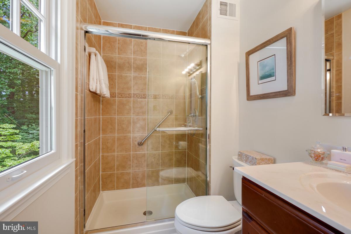 11321 Marcliff Road North Bethesda, MD 20852 - Photo 30 of 48 a bathroom with a sink toilet and shower