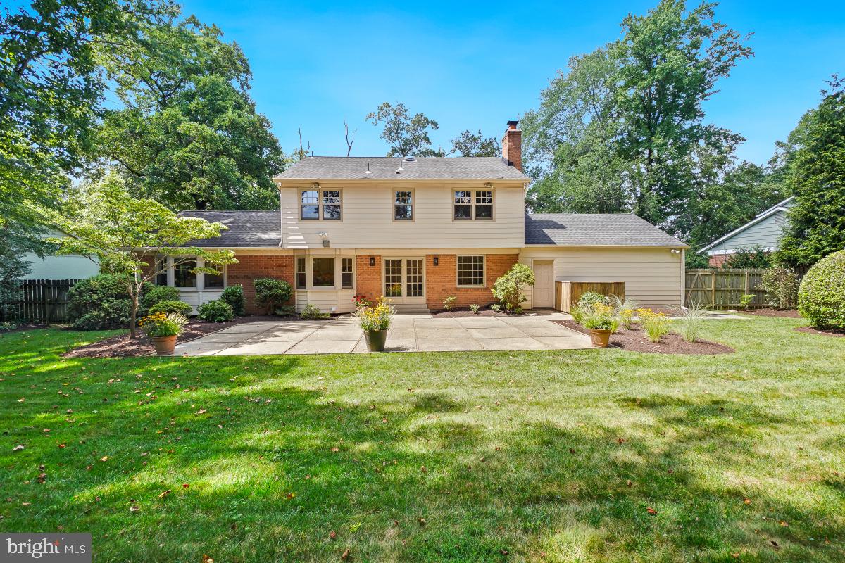11321 Marcliff Road North Bethesda, MD 20852 - Photo 44 of 48 a front view of a house with a garden and plants