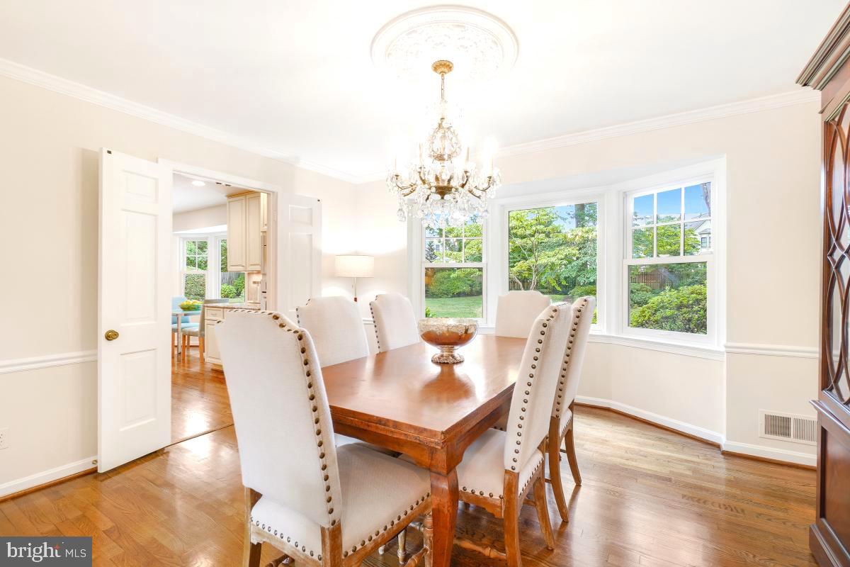 11321 Marcliff Road North Bethesda, MD 20852 - Photo 8 of 48 a view of a dining room with furniture wooden floor and chandelier