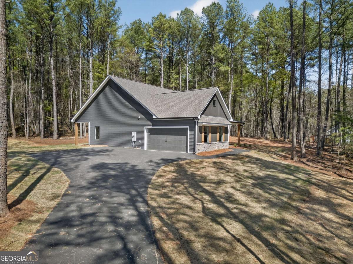 338 Dunn Road Cedartown, GA 30125 - Photo 37 of 44 a house with trees in the background