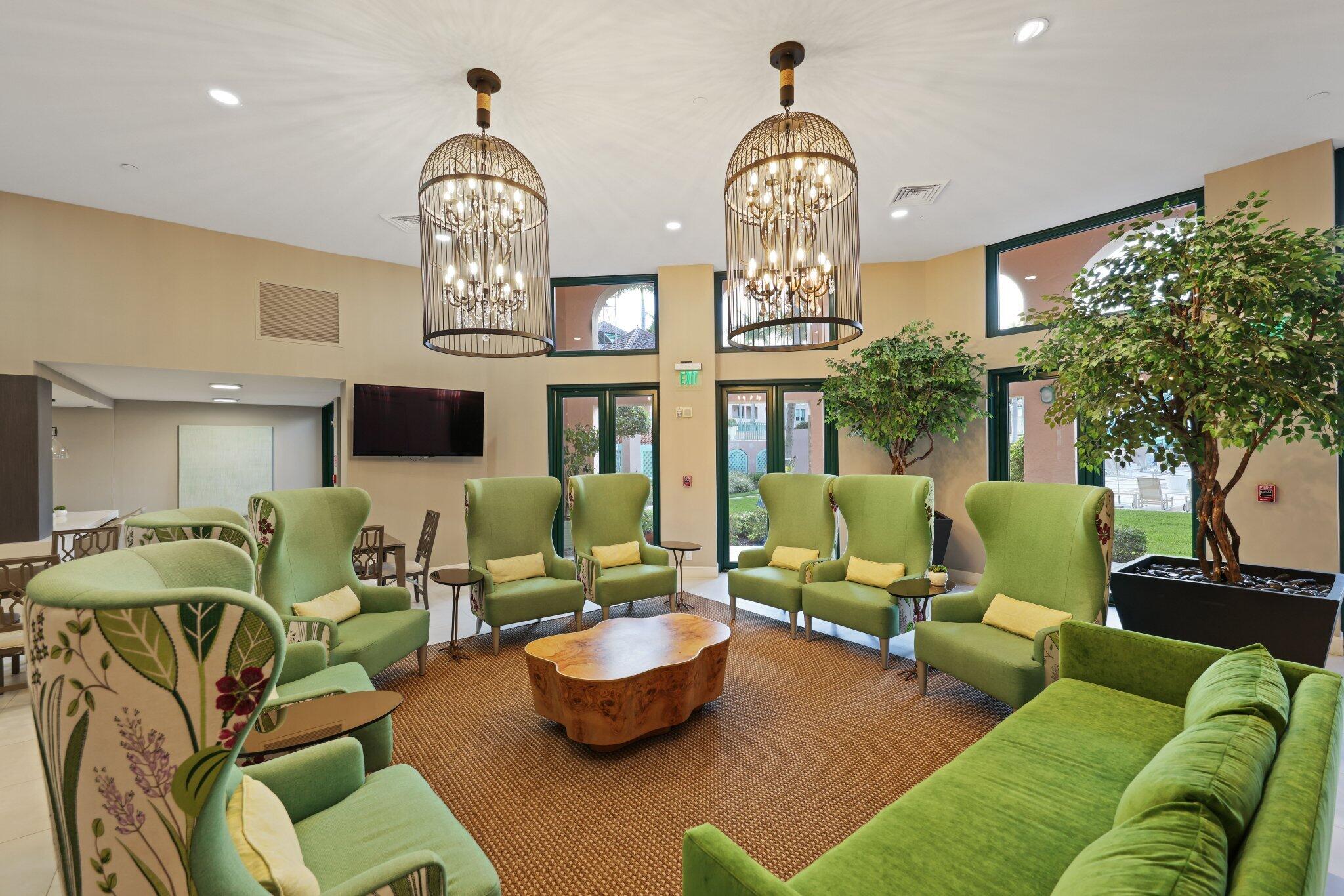 100 Southeast 5th Avenue, Unit 106 Boca Raton, FL 33432 - Photo 55 of 81 a living room with furniture chandelier and a chandelier
