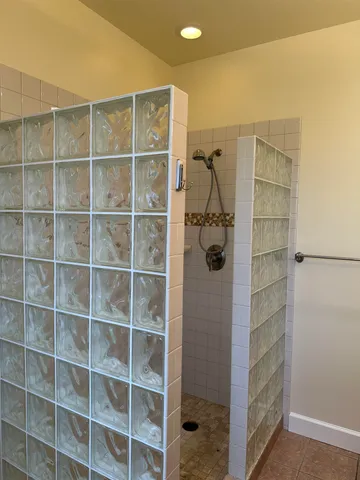 a view of a walk in closet and bathroom