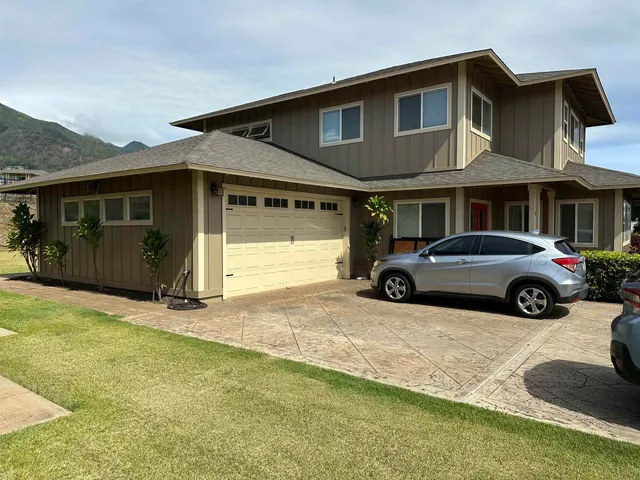 a car parked in front of a house