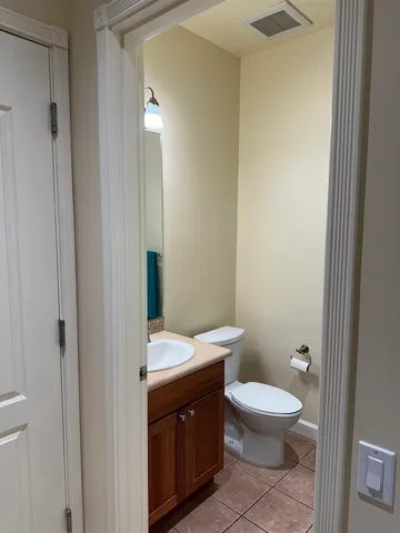a bathroom with a toilet a sink and shower