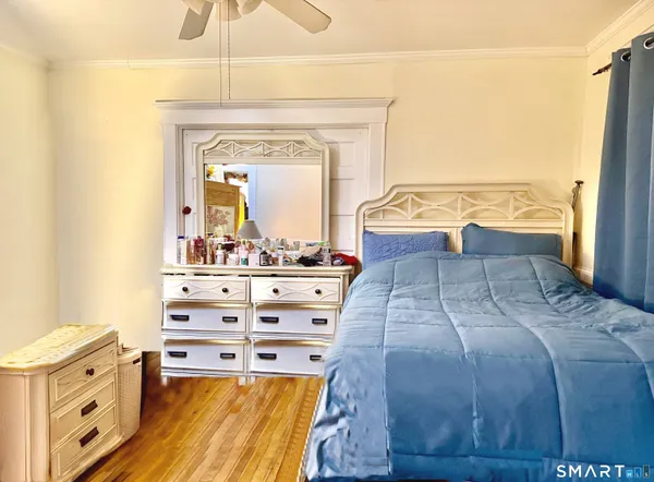 a bedroom with furniture and a window