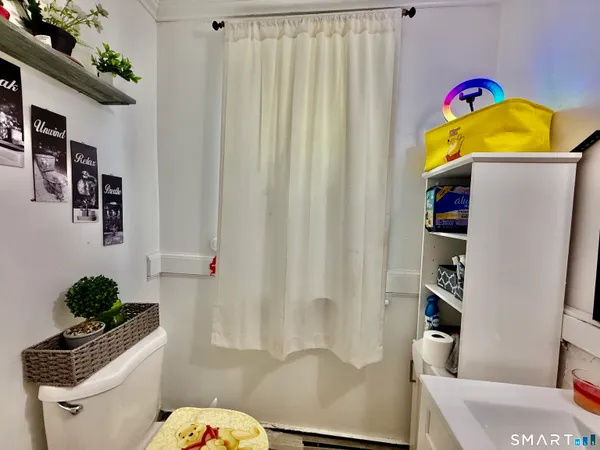 a room with furniture a window and a table