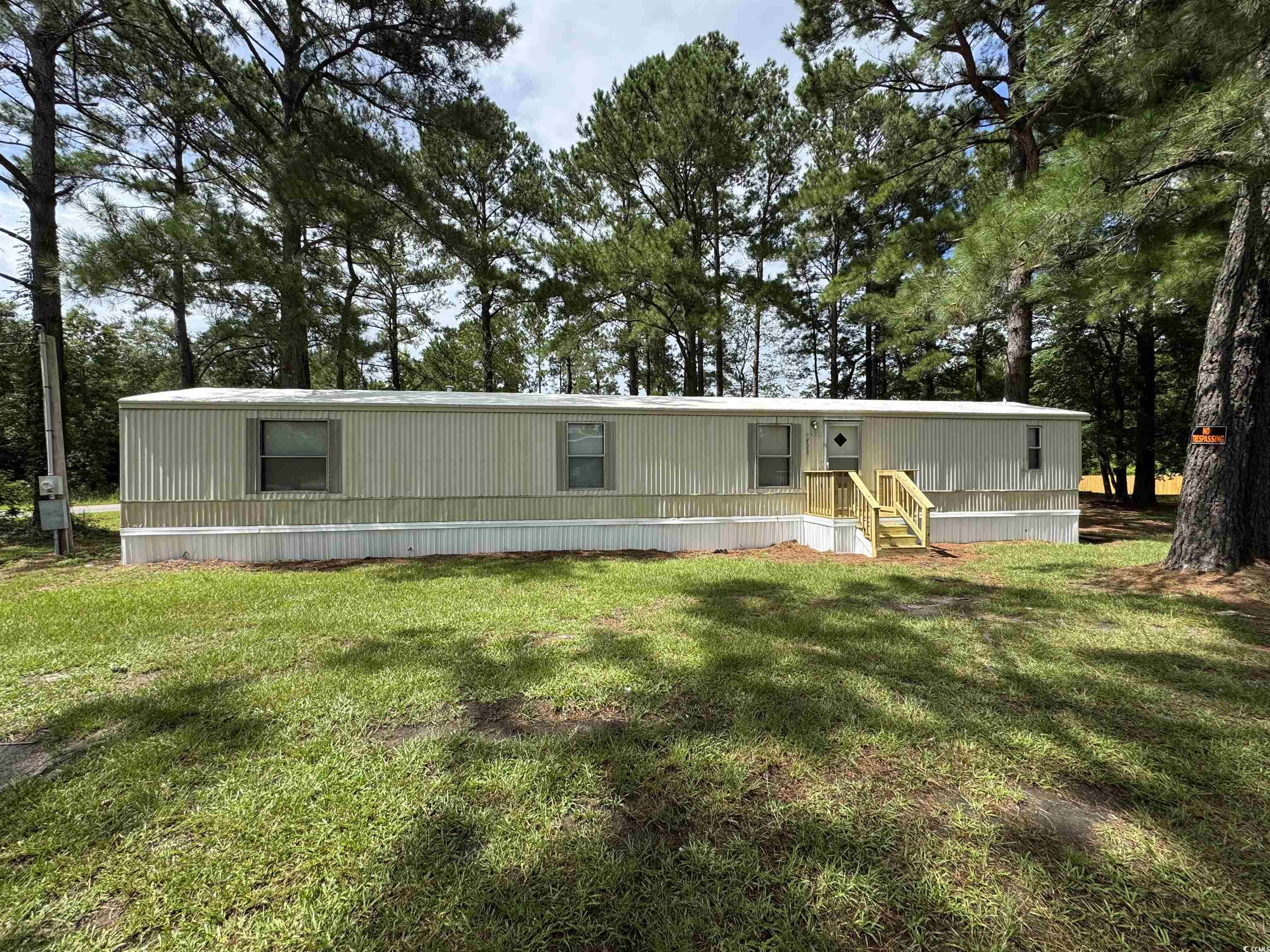 Tbd Still Pond Road Conway, SC 29526 - Photo 2 of 18 View of front facade with a front lawn and view of scattered trees