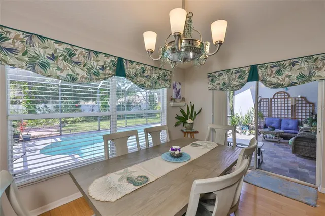 a living room with furniture and a book shelf
