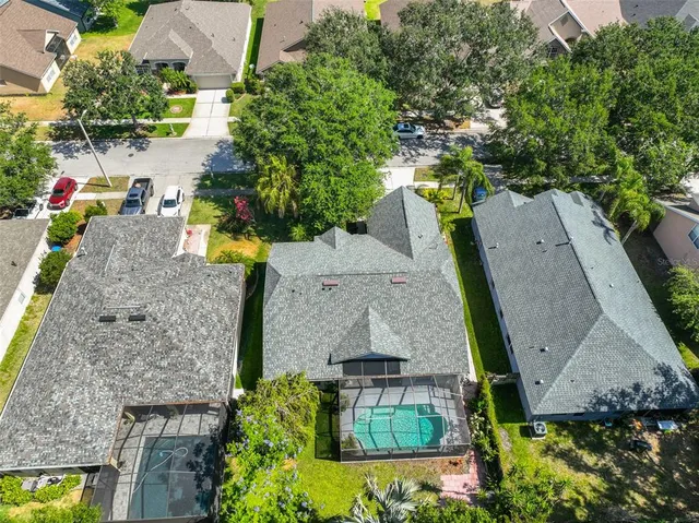 an aerial view of a house with outdoor space