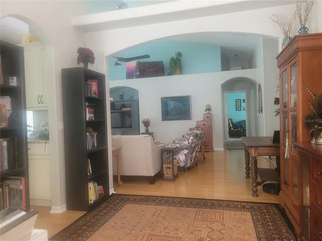 a bedroom with a bed and a table in it