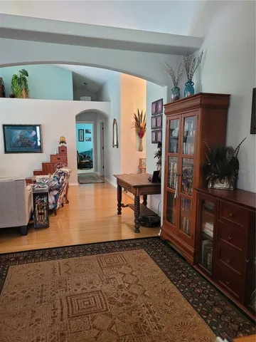 a spacious bathroom with a granite countertop tub sink a mirror a shower and vanity