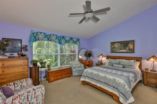 a bathroom with a tub and a window