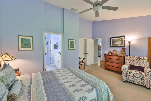 a bathroom with a sink a toilet a mirror and shower