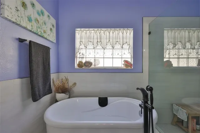 a bedroom with a bed and a large dresser