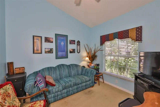 a utility room with fridge dryer and washer