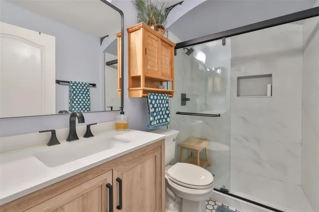 a view of an house with backyard porch and sitting area