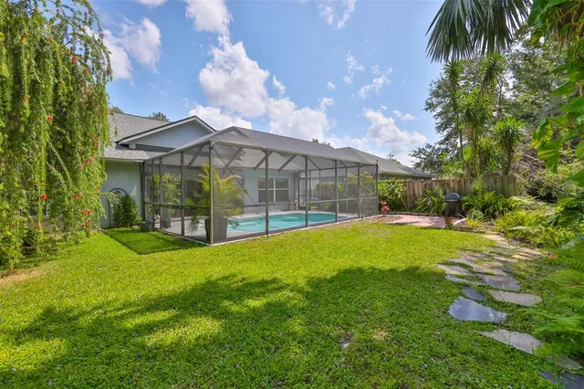 an aerial view of a house with a lake view