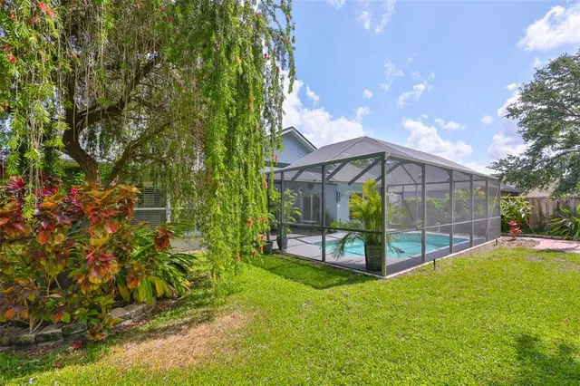 an aerial view of a houses with outdoor space