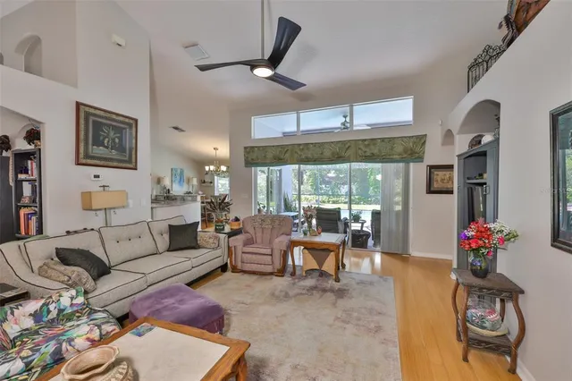 a living room with furniture and kitchen view