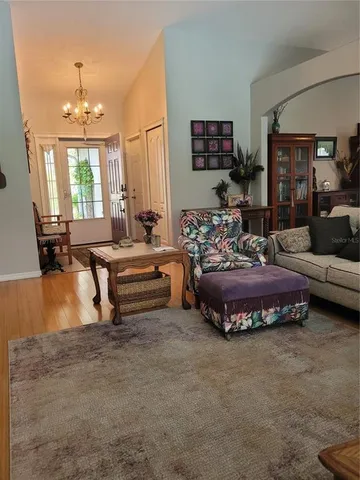 a kitchen with stainless steel appliances granite countertop a stove top oven a refrigerator and a sink with granite countertops