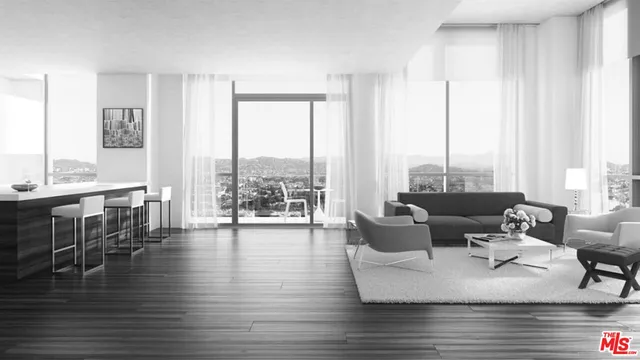 a living room with furniture and floor to ceiling windows