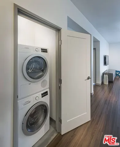 a view of a hallway with washer and dryer