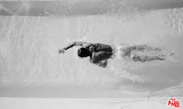 a view of a balcony with chair and potted plants