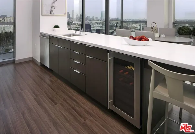 a room with a large window and furniture