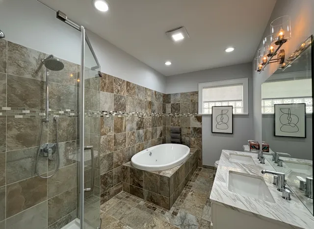 a bathroom with a sink toilet and shower