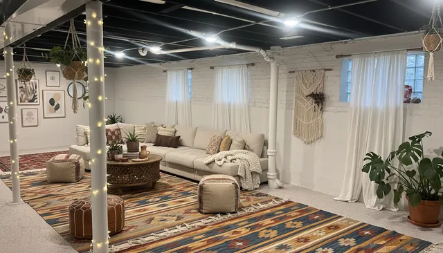 a living room with furniture and a potted plant