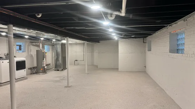 a view of an empty room with a fireplace