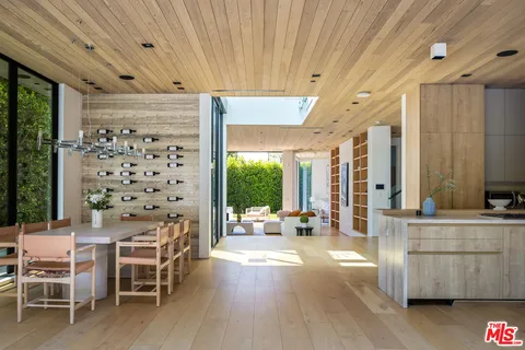 a work room with furniture and a wooden floor