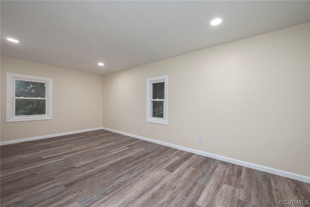 916 Nutbush Road Victoria, VA 23974 - Photo 18 of 25 a view of an empty room with wooden floor and a window