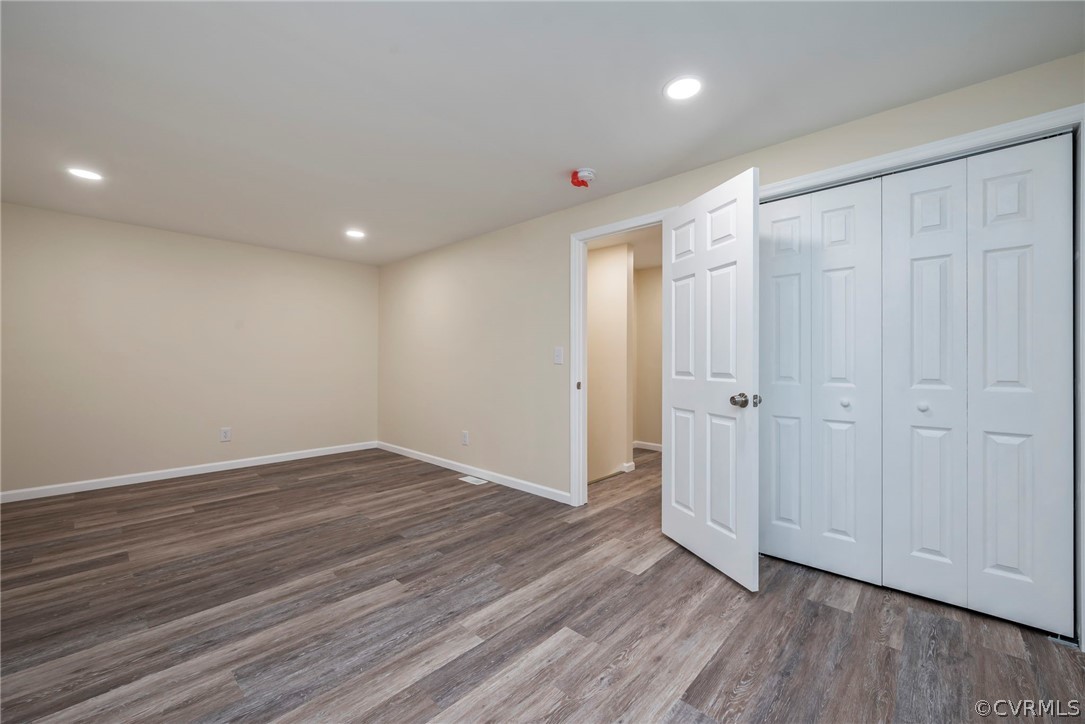 916 Nutbush Road Victoria, VA 23974 - Photo 19 of 25 a view of an empty room with wooden floor