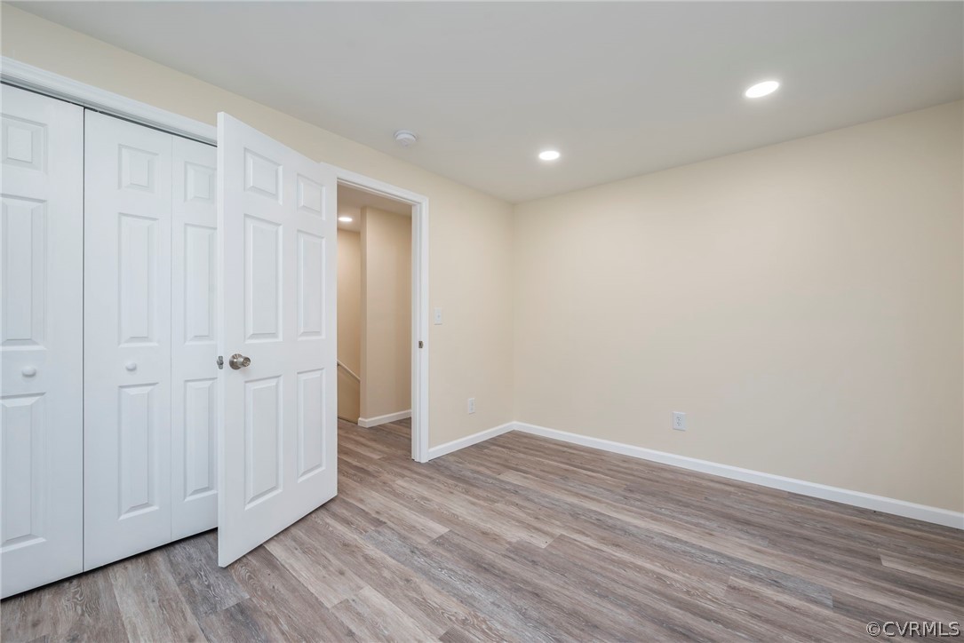916 Nutbush Road Victoria, VA 23974 - Photo 21 of 25 a view of an empty room with wooden floor