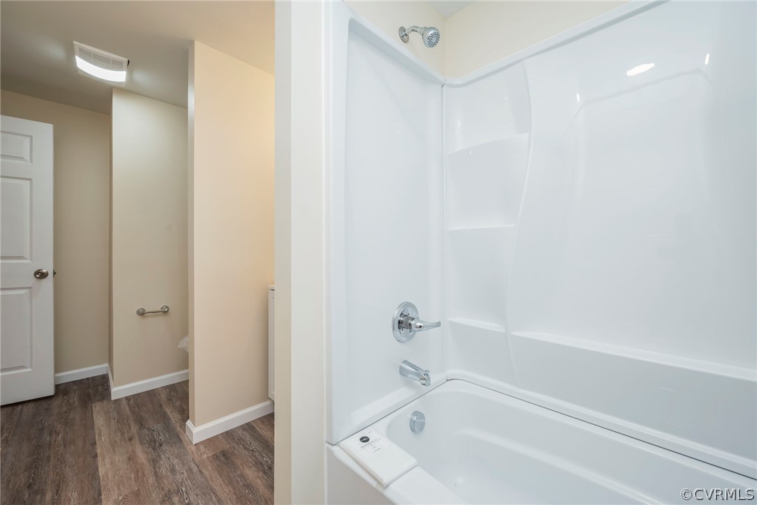 916 Nutbush Road Victoria, VA 23974 - Photo 23 of 25 a white bath tub sitting next to a shower